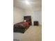 Comfortable bedroom with a bed, nightstand, and window, creating a cozy retreat at 160 Grafton St, Hampton, GA 30228
