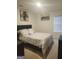 Serene bedroom featuring neutral colors, a comfortable bed, and ample natural light from the window at 160 Grafton St, Hampton, GA 30228
