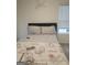 Cozy bedroom featuring neutral tones, natural light, and comfortable furnishings at 160 Grafton St, Hampton, GA 30228