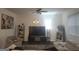 Bright living room with modern decor, featuring stylish furniture, a large TV, and ample space at 160 Grafton St, Hampton, GA 30228