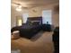 Bedroom with a ceiling fan, two windows, and a queen-sized bed at 160 Grafton St, Hampton, GA 30228
