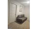 Cozy room featuring a gray sofa and neutral decor, providing a comfortable space at 160 Grafton St, Hampton, GA 30228