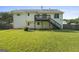 A large green backyard and elevated deck offer a perfect outdoor space with a home at 128 Southern Magnolia Ln, Rex, GA 30273