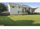 Lush green backyard offers a serene escape and complements this home's inviting exterior at 128 Southern Magnolia Ln, Rex, GA 30273