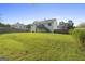Expansive green backyard with a well-maintained lawn, ideal for outdoor activities and entertaining at 128 Southern Magnolia Ln, Rex, GA 30273