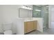 Contemporary bathroom with a double vanity, toilet, and glass-enclosed shower at 128 Southern Magnolia Ln, Rex, GA 30273