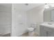 Functional bathroom design with tub-shower combo, storage shelving, and neutral vanity at 128 Southern Magnolia Ln, Rex, GA 30273