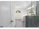 Modern bathroom showcasing a glass shower, stylish tile, and elegant fixtures at 128 Southern Magnolia Ln, Rex, GA 30273