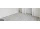 Spacious bedroom featuring neutral walls, plush carpet, and open doorway to the rest of the home at 128 Southern Magnolia Ln, Rex, GA 30273