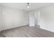 Spacious bedroom features wood floors, a ceiling fan, and neutral walls at 128 Southern Magnolia Ln, Rex, GA 30273