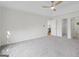 Bedroom features tray ceilings, fan, plush carpet, and doorways to the rest of the home at 128 Southern Magnolia Ln, Rex, GA 30273