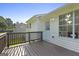 Inviting wooden deck perfect for outdoor dining and relaxation, with views of the lush backyard at 128 Southern Magnolia Ln, Rex, GA 30273