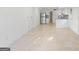 Spacious living area featuring tile flooring and an open layout with a view of the kitchen at 128 Southern Magnolia Ln, Rex, GA 30273