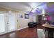 Basement featuring a laminate floor, a ceiling fan, and access to the exterior of the house at 860 Sweet Mill Ln, Lawrenceville, GA 30045