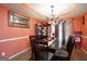 Cozy dining room with a glass-top table, wooden chairs, and decorative accents at 860 Sweet Mill Ln, Lawrenceville, GA 30045