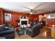 Well-lit living room featuring hardwood floors, a fireplace, and an array of decor at 860 Sweet Mill Ln, Lawrenceville, GA 30045