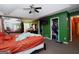 Spacious main bedroom featuring a trey ceiling, ceiling fan, mirrorred closet doors and ensuite bathroom access at 860 Sweet Mill Ln, Lawrenceville, GA 30045