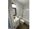 Bathroom featuring a modern single sink vanity, toilet, and shower-tub combo at 60 Doe Run Dr, Sharpsburg, GA 30277