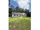 Charming single-story home with a well-maintained lawn and lush greenery at 60 Doe Run Dr, Sharpsburg, GA 30277