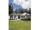 Attractive home featuring stone accents and manicured landscaping at 60 Doe Run Dr, Sharpsburg, GA 30277