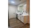 Updated kitchen featuring white cabinets and modern countertops at 60 Doe Run Dr, Sharpsburg, GA 30277