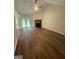 Bright living room with a fireplace and French doors to the outside at 60 Doe Run Dr, Sharpsburg, GA 30277