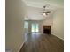 Vaulted ceilings, wood-look floors, fireplace, and French doors enhance this living space at 60 Doe Run Dr, Sharpsburg, GA 30277