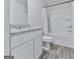 Modern bathroom featuring granite counters, white cabinets, and a shower over tub with a curtain at 520 Pemberton St, Euharlee, GA 30145