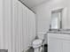 This cozy bathroom features a shower and tub with a toilet and sink at 520 Pemberton St, Euharlee, GA 30145