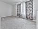 Large bedroom featuring plush carpet, natural light and decorative curtains at 520 Pemberton St, Euharlee, GA 30145