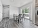 Bright dining room showcases a modern table with seating for four and a sliding glass door at 520 Pemberton St, Euharlee, GA 30145