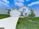 Attractive two-story home with white siding, attached garage, and lush green lawn at 520 Pemberton St, Euharlee, GA 30145