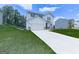 Picturesque two-story home with white siding, spacious driveway, and manicured lawn at 520 Pemberton St, Euharlee, GA 30145