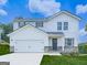 Charming two-story home with white siding, brick accents, two-car garage, and manicured lawn at 520 Pemberton St, Euharlee, GA 30145