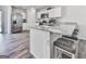 Stylish kitchen with stainless steel appliances, granite countertops, and breakfast bar seating at 520 Pemberton St, Euharlee, GA 30145