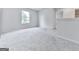 Upstairs loft area featuring plush carpeting and natural light at 520 Pemberton St, Euharlee, GA 30145