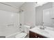 Bathroom featuring a tub, toilet, sink with vanity, and mirror at 7335 Connell Rd, Fairburn, GA 30213