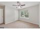 Carpeted bedroom with closet and natural light at 7335 Connell Rd, Fairburn, GA 30213