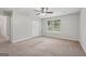 Bedroom with neutral walls, carpet, ceiling fan, and closet at 7335 Connell Rd, Fairburn, GA 30213
