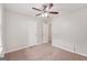 Bedroom with ceiling fan, carpet, and closet at 7335 Connell Rd, Fairburn, GA 30213