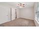 Bedroom with carpet, ceiling fan, and closet at 7335 Connell Rd, Fairburn, GA 30213