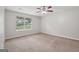 Bedroom with neutral walls, carpet, a ceiling fan, and a window at 7335 Connell Rd, Fairburn, GA 30213