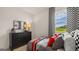 This bedroom features a checkered curtain and race car decor, perfect for a room at 143 Oakchase Park Ln, Hampton, GA 30228