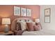Charming bedroom features plush bedding, ambient lighting, and artistic unicorn-themed prints at 143 Oakchase Park Ln, Hampton, GA 30228