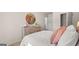 Bright bedroom with playful decor and a rustic wooden dresser with unique mirror accent at 143 Oakchase Park Ln, Hampton, GA 30228