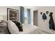 Well-lit bedroom with playful decor, window view, and easy access to closet storage at 143 Oakchase Park Ln, Hampton, GA 30228