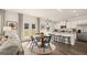 Bright living area with modern kitchen featuring stainless steel appliances and a view to the backyard at 143 Oakchase Park Ln, Hampton, GA 30228