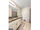 Cozy bathroom featuring granite countertops, wainscoting, and tile flooring at 10215 Creel Rd, Chattahoochee Hills, GA 30213