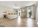 Large bedroom featuring lots of natural light, hardwood-style floors, and private balcony access at 10215 Creel Rd, Chattahoochee Hills, GA 30213