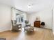 Inviting living room with hardwood-style floors, natural light, and comfortable seating area at 10215 Creel Rd, Chattahoochee Hills, GA 30213